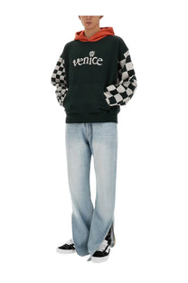 Erl men’s black sweatshirt with black and white checkered sleeve hoodie and white venice logo on chest