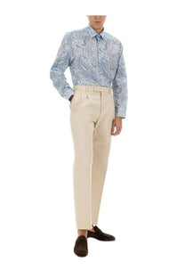Beige tailored trousers with a clean straight-leg cut and belt loops paired with etro men’s blue cotton shirt