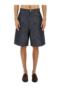 Dark blue ETRO men’s jacquard denim bermuda shorts with intricate lighter paisley pattern and detailed fabric texture