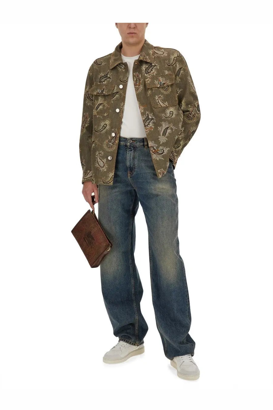 Brown leather clutch with embossed logo paired with etro men’s denim blue jeans in a casual outfit setting