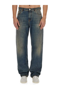 Etro men’s washed blue denim jeans with relaxed wide-leg cut and faded distressing in denim blue
