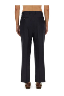 Black wool etro men’s tailored trousers with straight-leg cut and subtle back pleats showing the back side