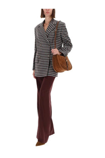 Brown suede shoulder bag with curved top and front zipper closure paired with etro women’s grey double breasted jacket