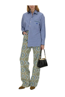 Black leather mini handbag with gold-tone hardware and top handle paired with etro womens blue paisley jeans