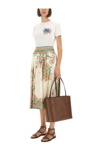 Brown leather tote bag with embossed paisley pattern complementing etro women’s paisley print midi skirt multicolor