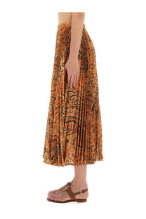Etro women’s pleated sablé skirt in vibrant orange with black and gold paisley patterns and flowing midi length