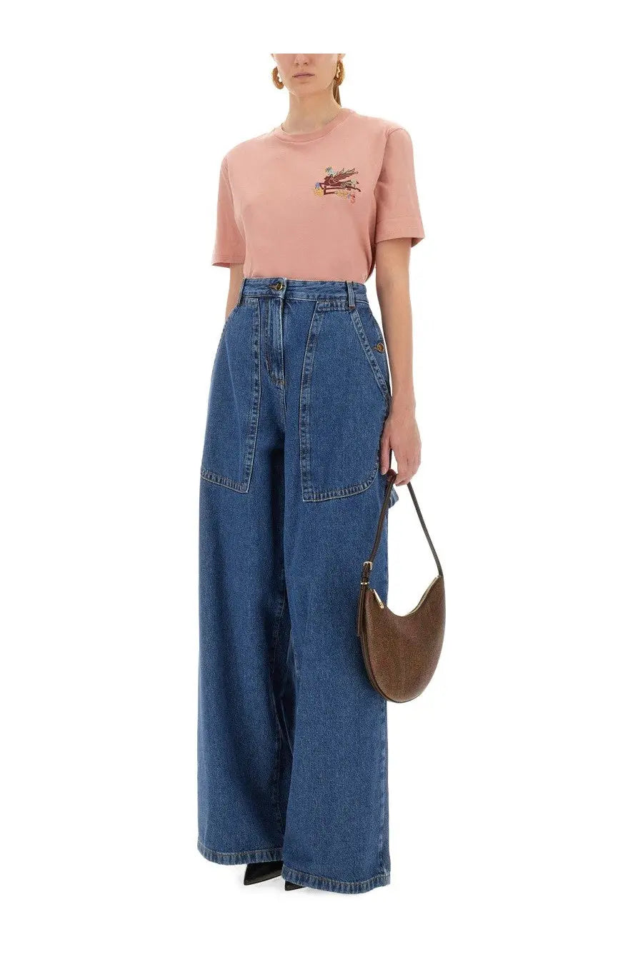 Brown leather crescent-shaped handbag paired with etro women’s blue shirt showcasing stylish accessory and outfit combination