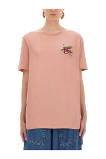 A soft pink short-sleeved shirt from etro featuring a colorful embroidered graphic on the chest