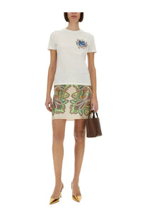 White t-shirt with embroidered crest on the chest paired with etro women’s multicolor silk mini skirt