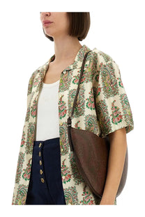 Brown textured leather shoulder bag with curved design and adjustable strap featured with ETRO women’s silk shirt multicolor