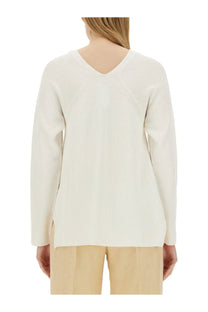 Fabiana Filippi women’s cream-colored ribbed knit sweater with v-neckline and long sleeves in white