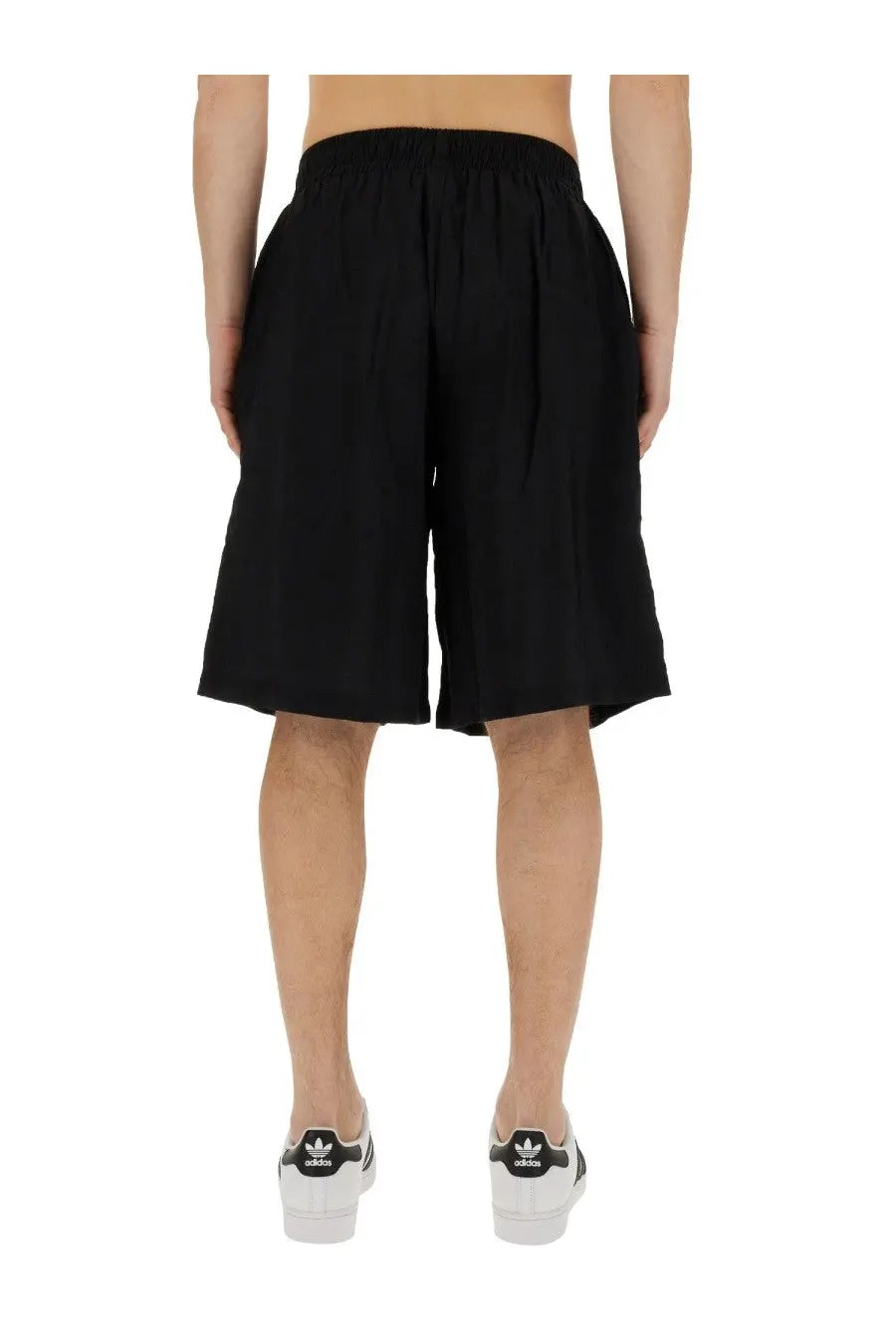 Black adidas family first men’s bermuda shorts with elastic waistband and relaxed wide-leg cut