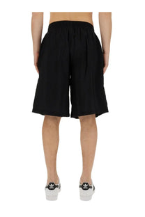 Black adidas family first men’s bermuda shorts with elastic waistband and relaxed wide-leg cut