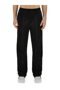 Family first men’s pleated black corduroy trousers with relaxed straight-leg cut and elastic waistband front view