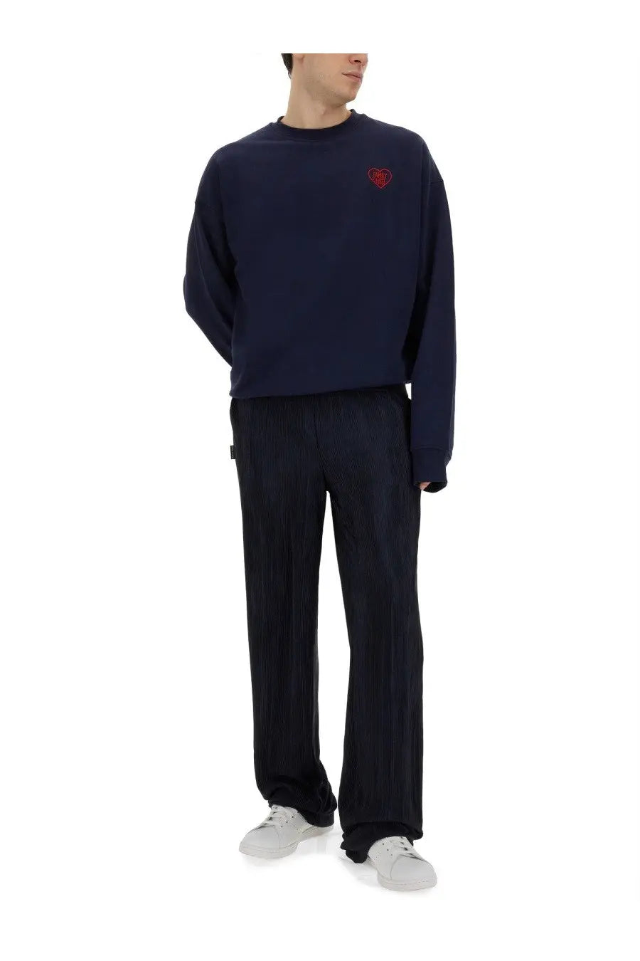 Navy blue oversized sweatshirt with red embroidered heart on left chest paired with family first men’s pleated blue pants