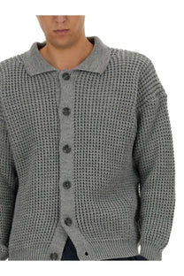 Gray waffle-knit polo-style cardigan with dark gray buttons from family first men’s collection in grey
