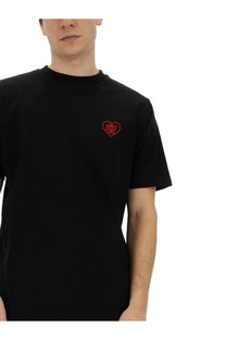Family first men’s black cotton t-shirt with a small red embroidered heart logo on the left chest