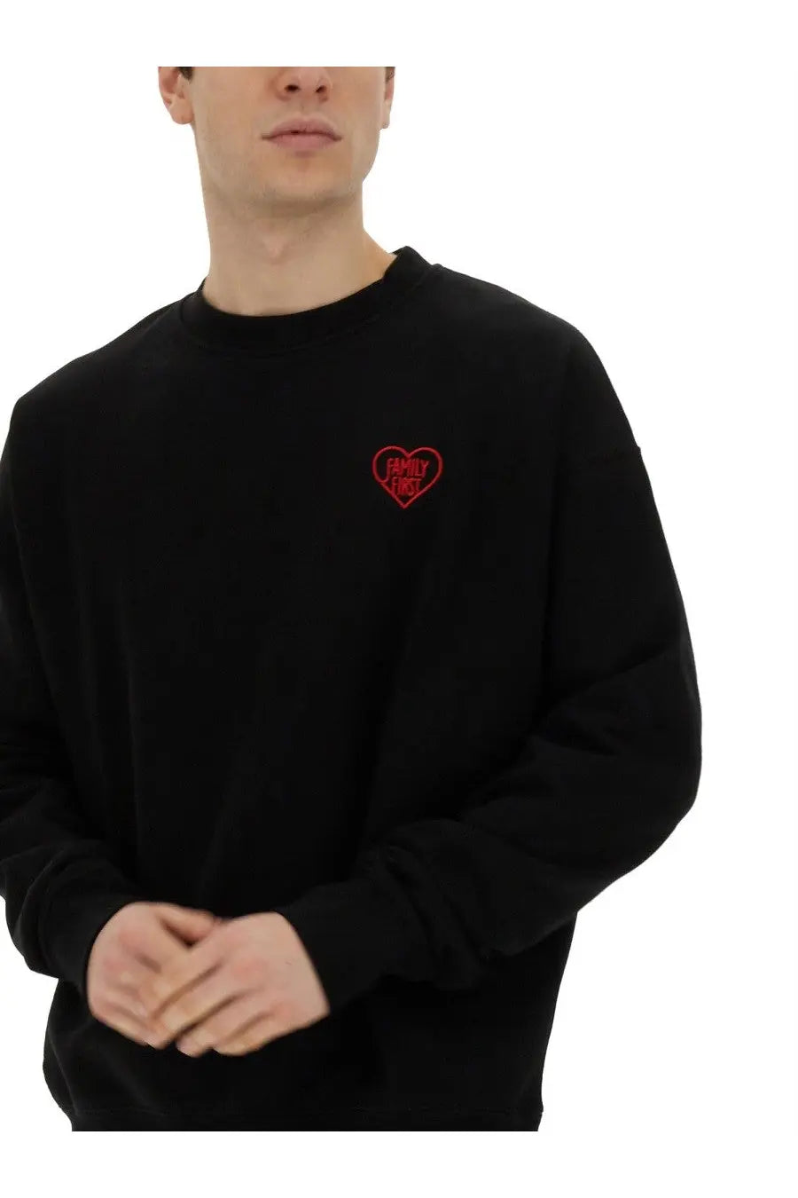 Family first men’s black long-sleeved crewneck sweatshirt with small red embroidered heart logo on left chest