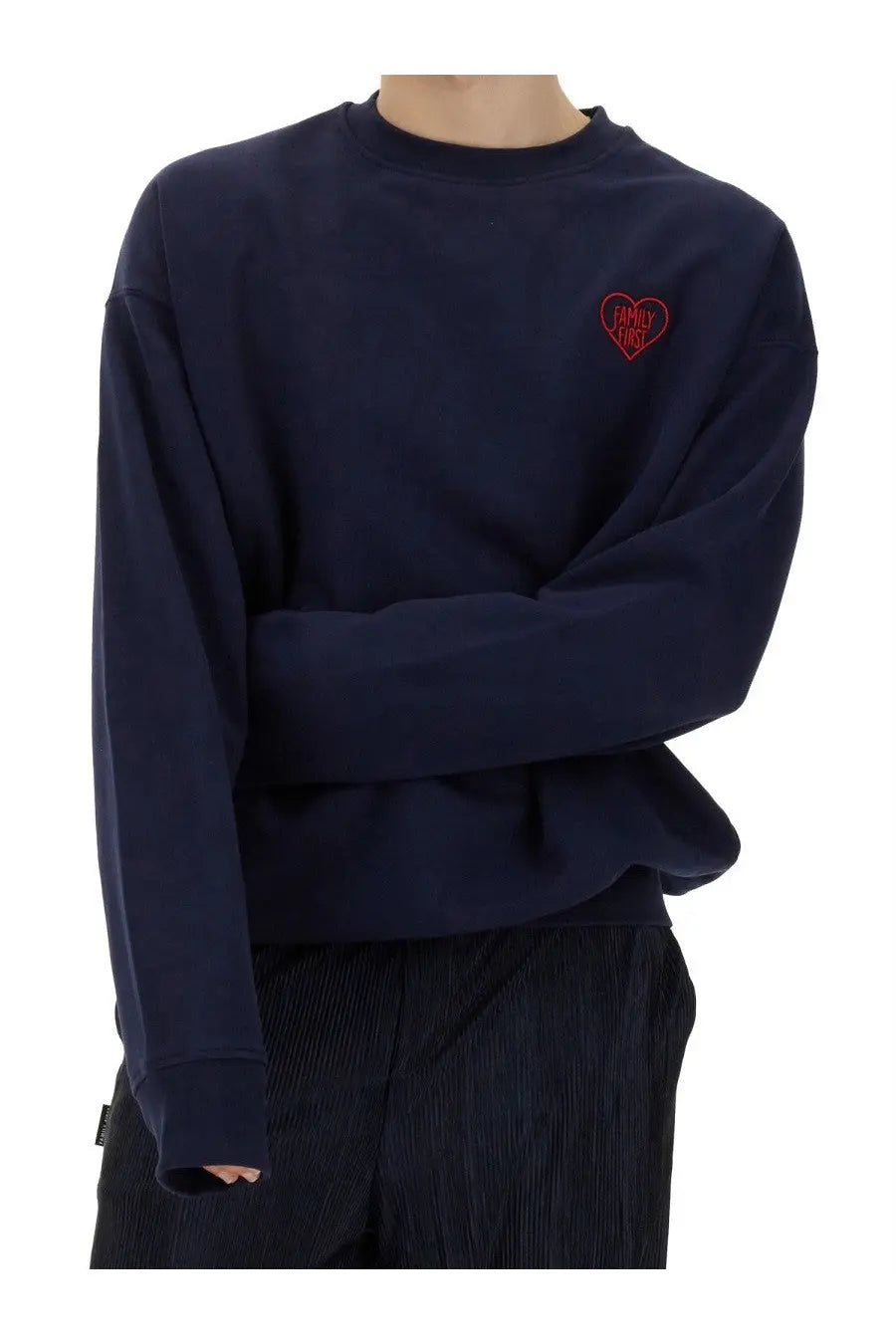 Navy blue crewneck sweatshirt with a red embroidered heart patch reading family first on the left chest
