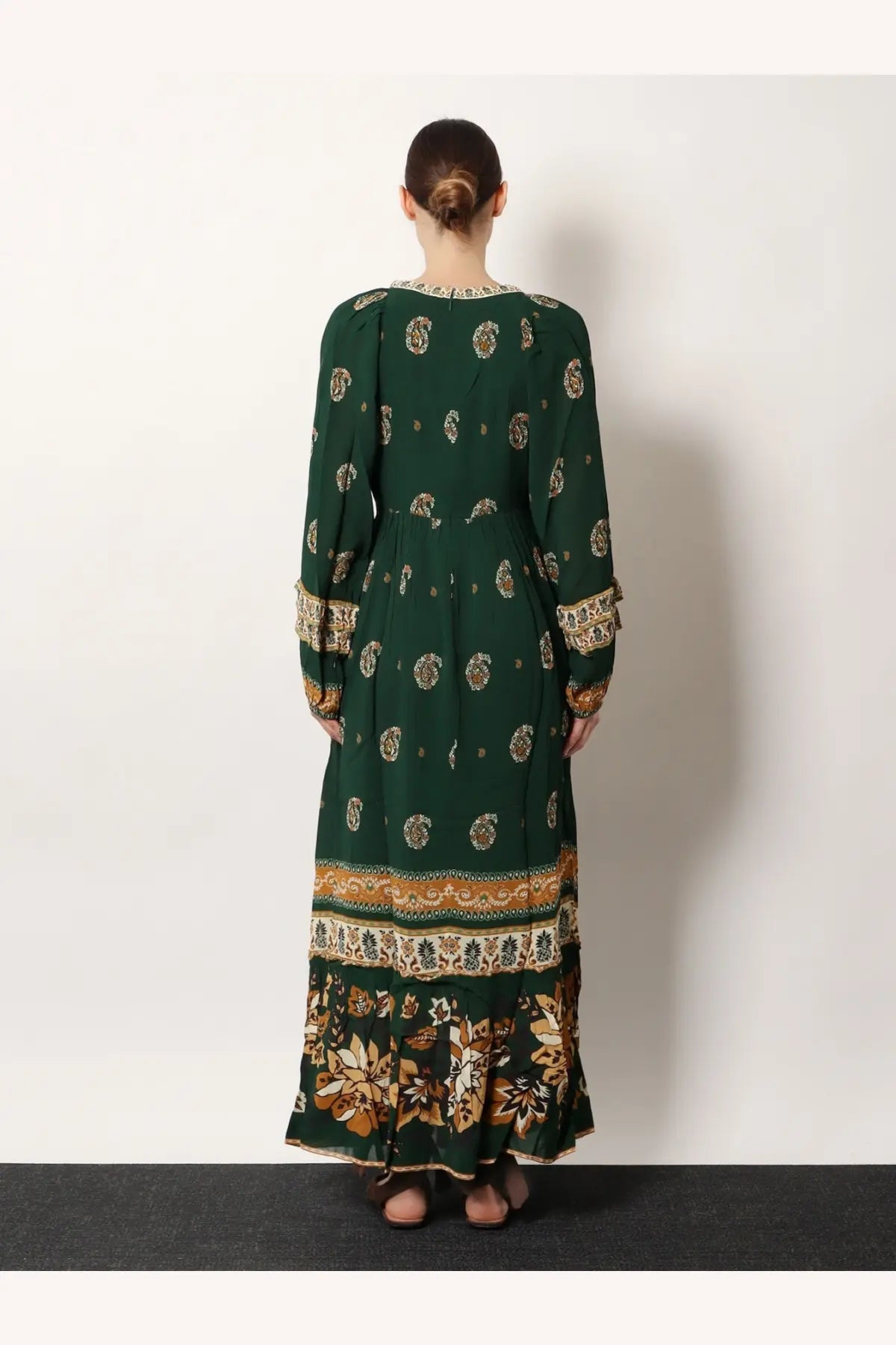 Farm Rio women’s Ayla maxi dress green with long sleeves and intricate gold and beige floral patterns on hemline and cuffs