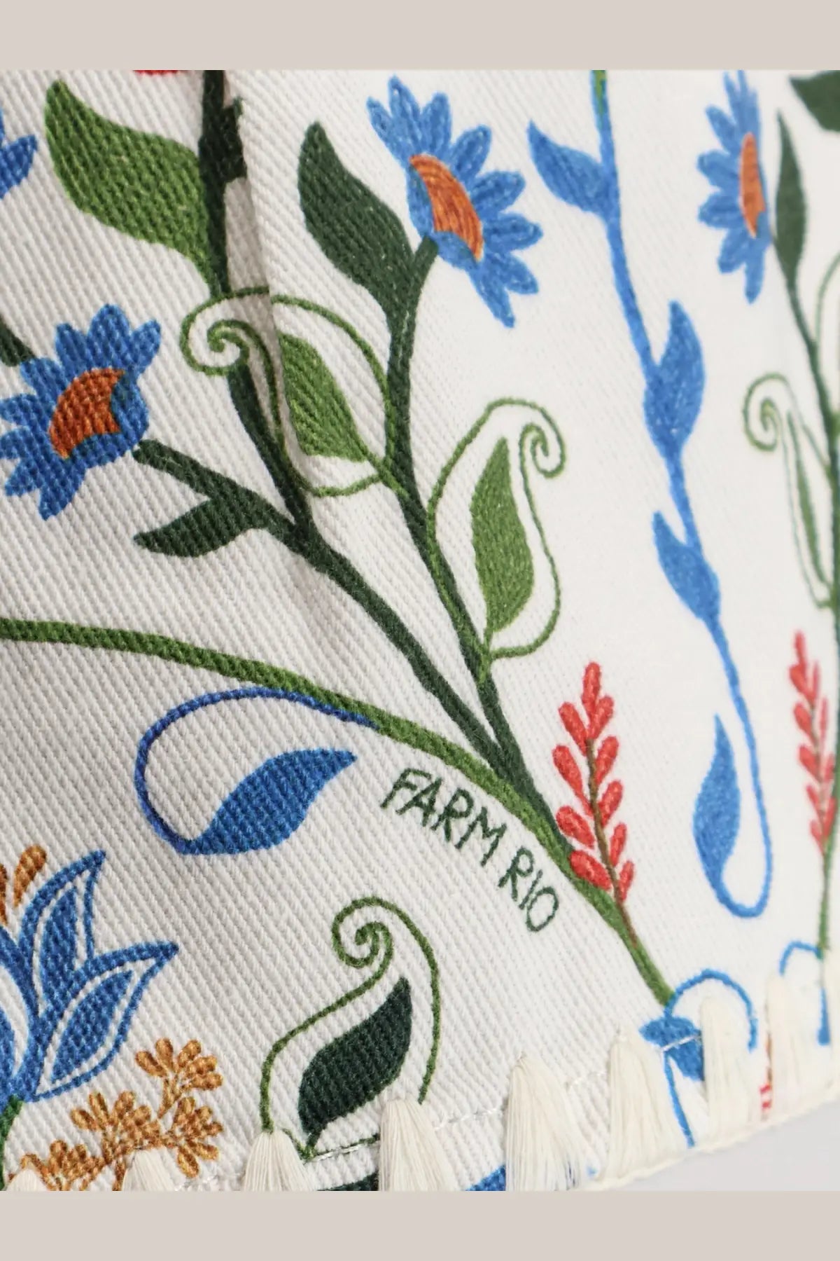 Farm rio women’s fraga multicolor cotton shorts with white fabric and embroidered blue green and orange floral patterns