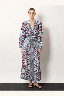 Farm Rio women’s Marcelle maxi dress in light blue with red and dark gray floral patterns, v-neckline, and belted waist