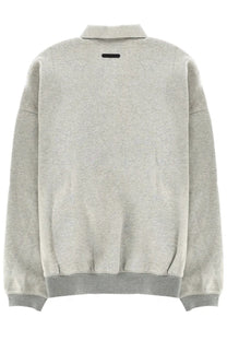 A heather gray oversized bomber jacket with ribbed collar and cuffs from Fear of God Essentials men’s collection