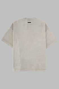 Beige oversized cotton t shirt with relaxed fit and subtle texture from fear of god essentials training 90s grey collection