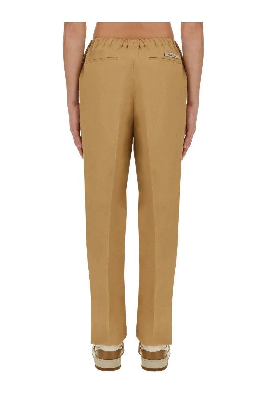 Fendi men’s canvas brown trousers with elastic waistband and two rear pockets shown from the back side