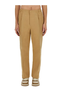 Fendi men’s canvas pants brown with tan pleated trousers featuring a relaxed fit and clean tailored lines