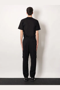 Black short-sleeved crew neck t-shirt with relaxed fit paired with fendi men’s black cargo nylon trousers