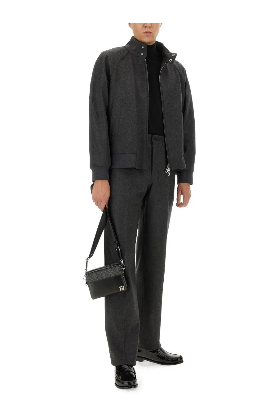 Black quilted leather crossbody bag with silver logo plaque paired with fendi men’s grey cashmere pants