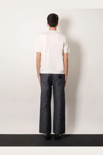 Dark gray wide-leg denim trousers with subtle texture and small black brand tag on the back waistband for men