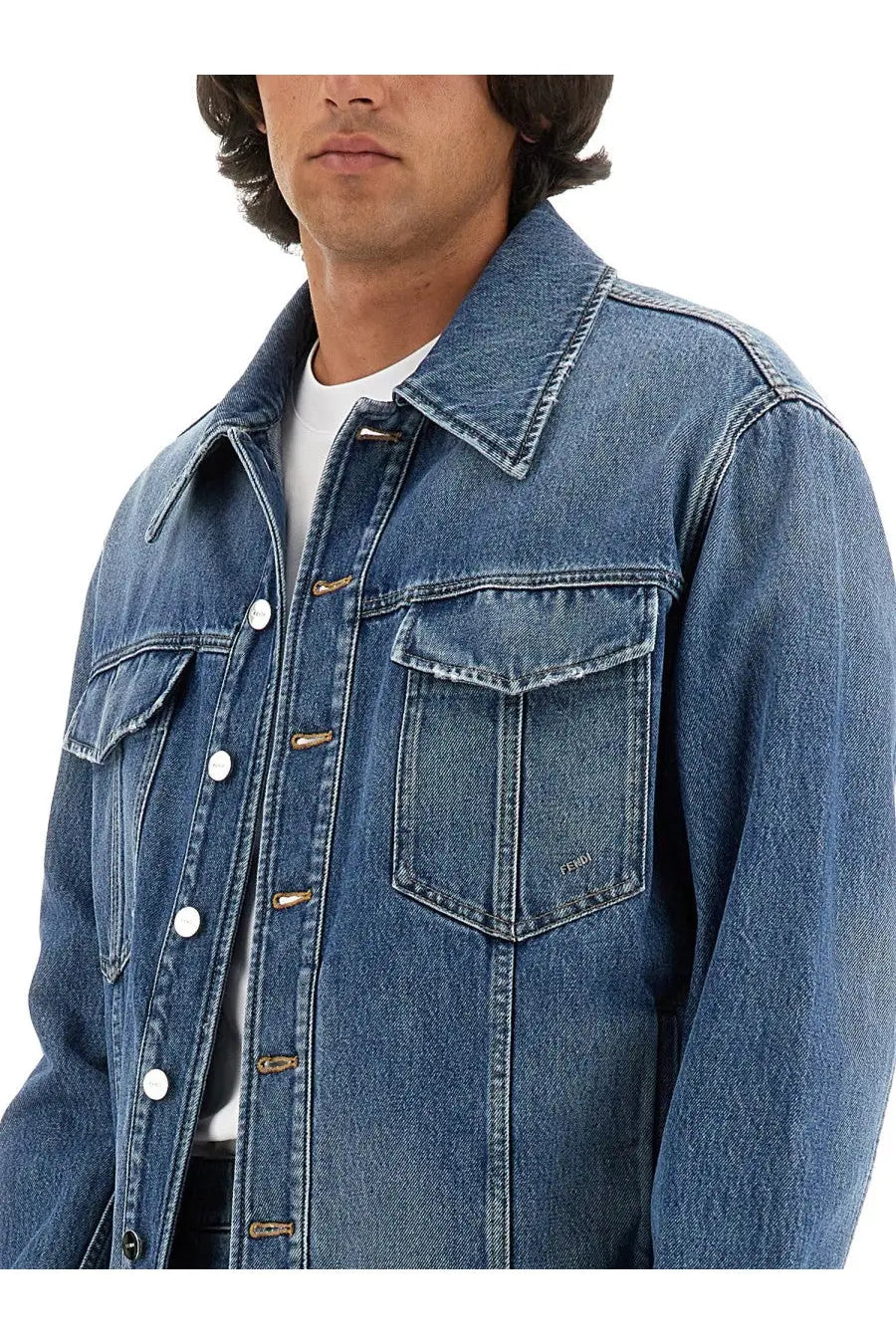 Fendi men’s blue denim jacket with white buttons and brown metal clasps showcasing a stylish casual look