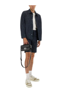 Black leather crossbody bag with silver-tone f logo hardware paired with fendi men’s blue ff jacquard denim shorts