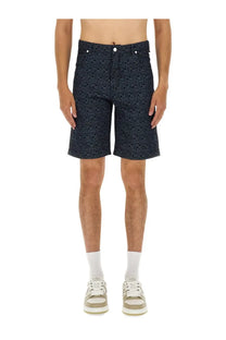 Fendi men’s dark blue denim shorts with a repeating lighter tone geometric jacquard pattern