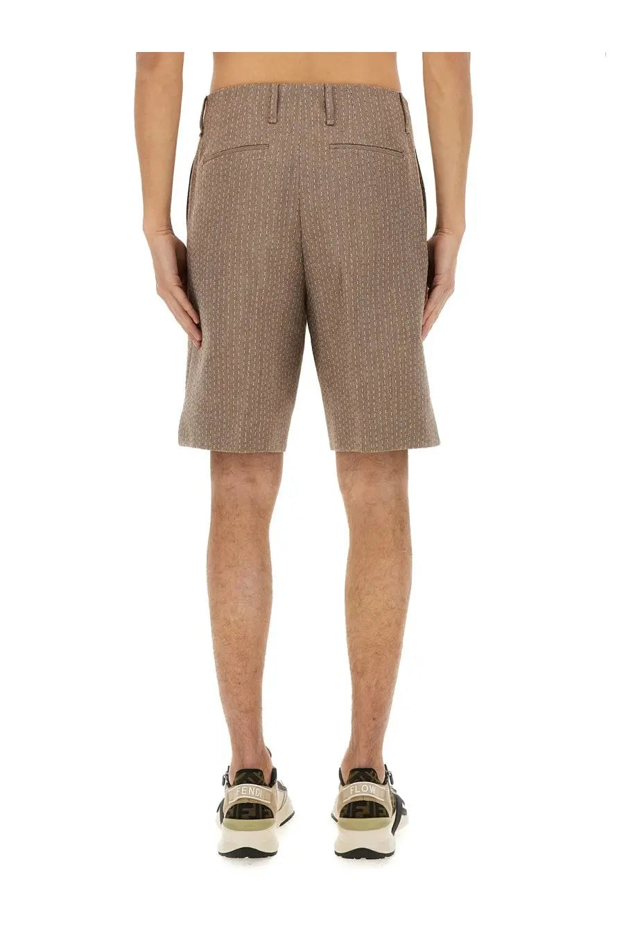 Beige textured Fendi men’s jacquard Bermuda shorts with subtle pinstripe pattern and two rear pockets shown from back
