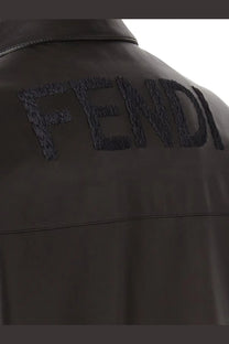 Back of fendi men’s black leather jacket with textured dark gray embroidered logo on the back