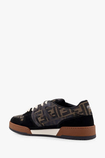 Black and brown Fendi men’s sneakers with monogram jacquard fabric, suede accents, and tan rubber soles
