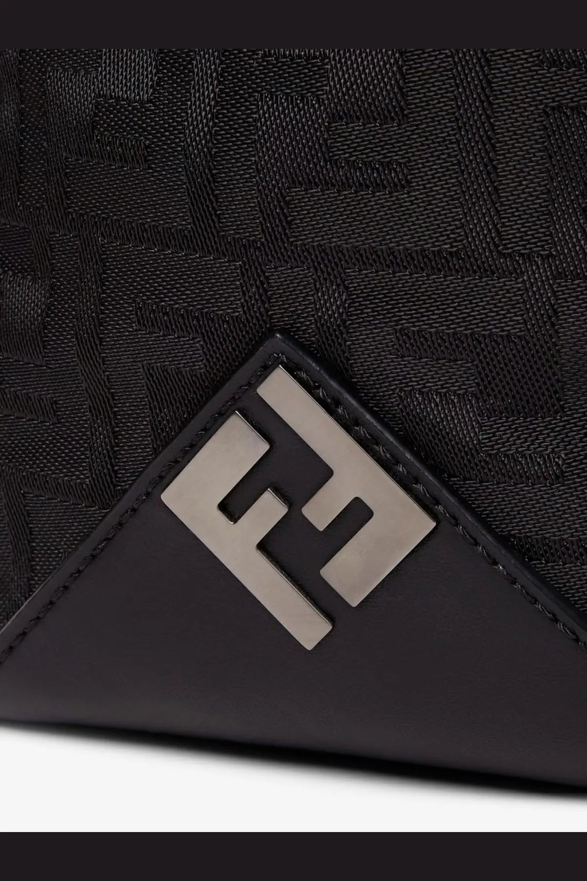 Black Fendi men’s padded nylon backpack featuring woven FF logo pattern and metallic silver-toned triangular emblem