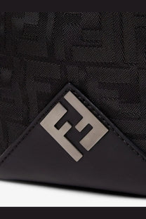 Black Fendi men’s padded nylon backpack featuring woven FF logo pattern and metallic silver-toned triangular emblem