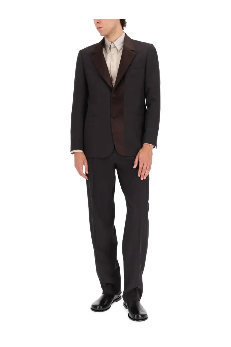 Fendi men’s single breasted tailored jacket in black with dark brown satin lapels worn over beige dress shirt