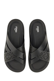 Fendi men’s black slide sandal with cross-over straps and textured patterned panels for casual wear