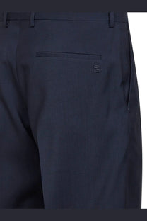Back side of dark navy blue fendi men’s tailored virgin wool trousers with subtle embroidered logo on back pocket