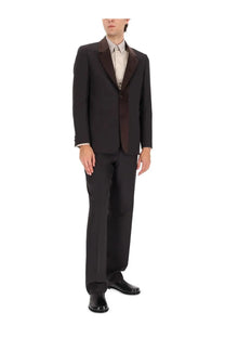 Black tailored suit with dark brown satin lapels and matching vest paired with fendi men’s brown wool blend pants