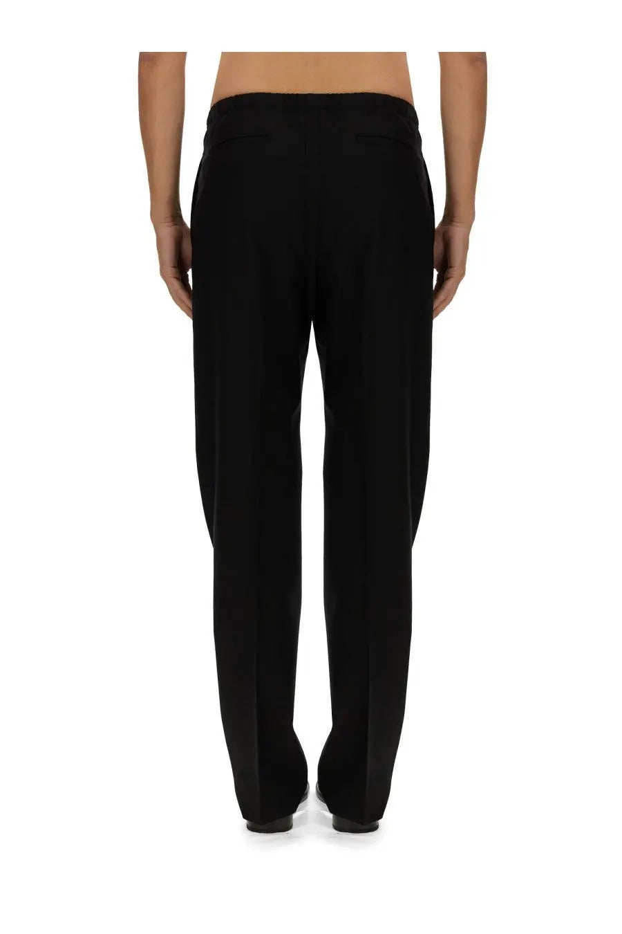 Fendi men’s black wool tailored trousers with sleek straight-leg cut and subtle pleats at the back side