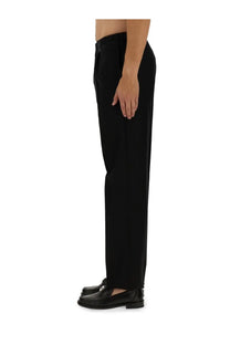 Fendi men’s black wool tailored trousers with a sleek straight-leg cut and subtle pleats at the waistband