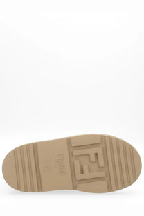Tan rubber sole with embossed fendi logo on fendi women’s apres chic boot brown showing the back side