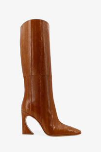 Beige leather knee-high boot with glossy finish and distinctive curved heel from Fendi women’s collection