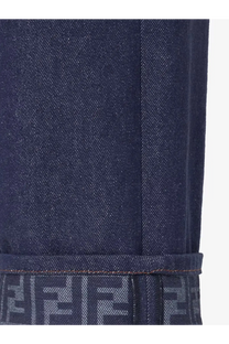 Fendi women’s blue denim jeans with dark blue material and repeating logo pattern on the rolled cuff